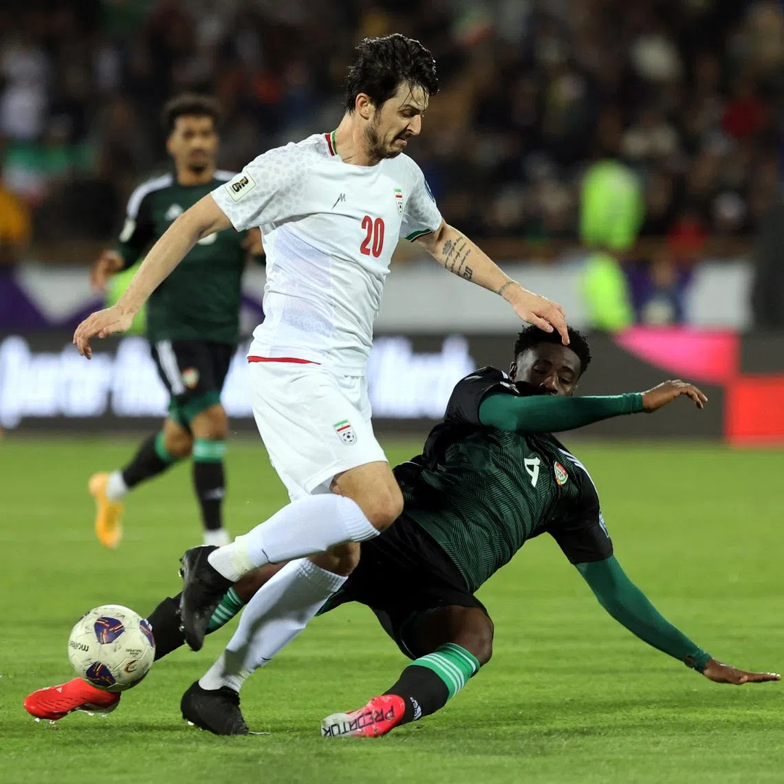 Soccer Football - World Cup - AFC Qualifiers - Third Round - Group A - Iran v United Arab Emirates - Azadi Sports Complex, Tehran, Iran - March 20, 2025 Iran's Sardar Azmoun in action with United Arab Emirates' Kouame Kouadio Majid Asgaripour/WANA (West Asia News Agency) via REUTERS   ATTENTION EDITORS - THIS IMAGE HAS BEEN SUPPLIED BY A THIRD PARTY.