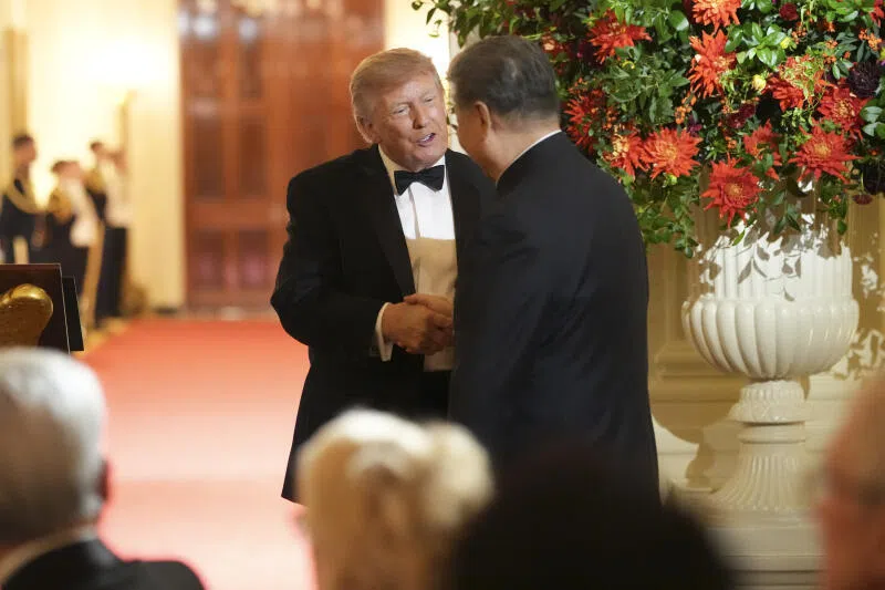 US President Donald Trump with Chinese President Xi Jinping during a state dinner at the White House on Sept 24.