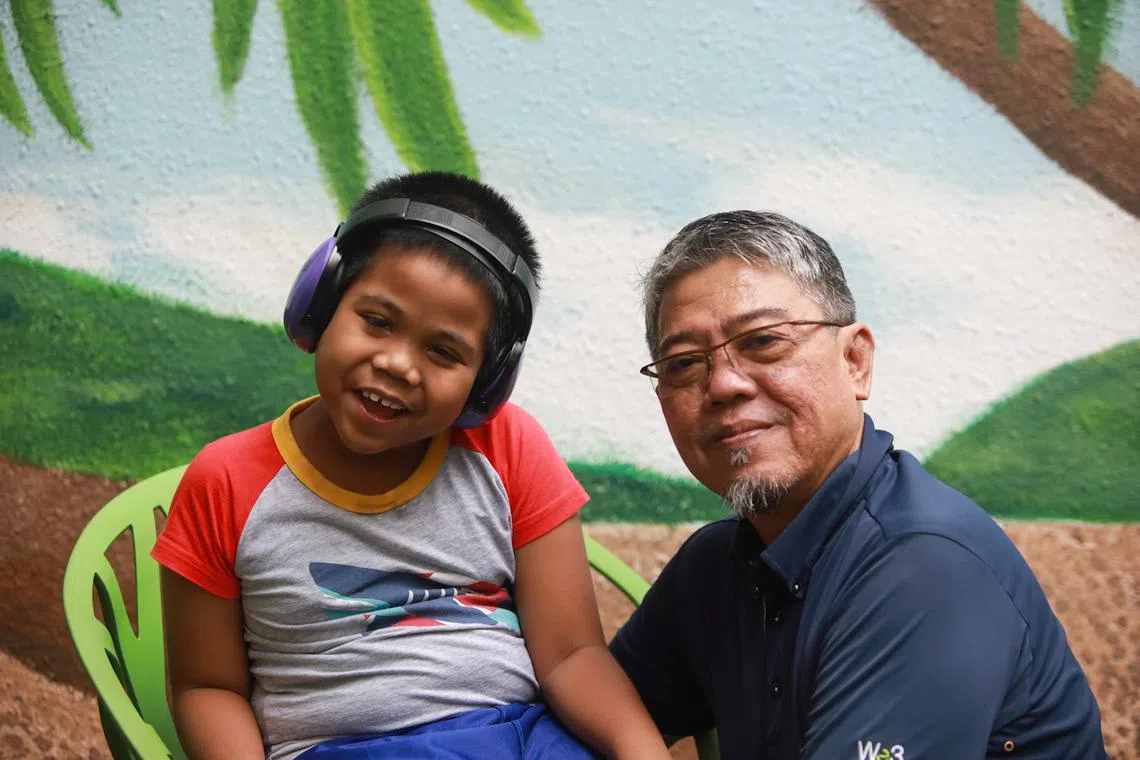 Mr Yusman Bin Kamis, 55, and his seven-year-old autistic son Farrel Alfatih Yusman.