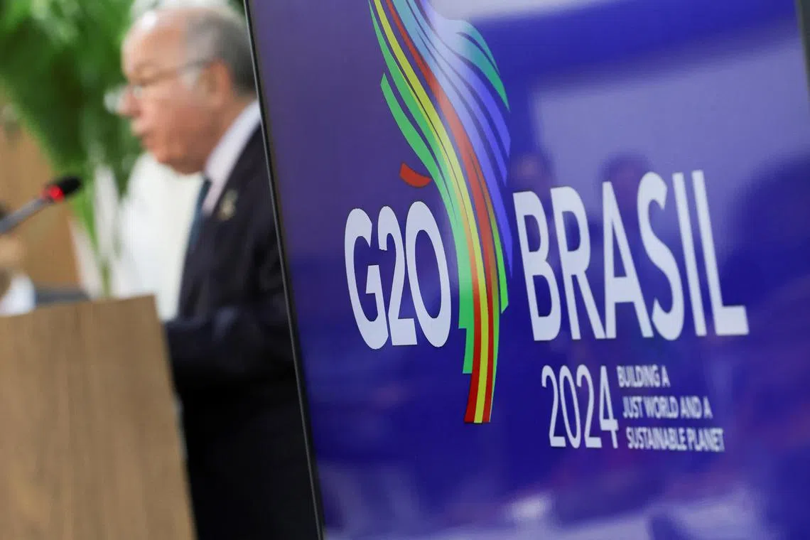 FILE PHOTO: A logo of G20 is displayed as Brazilian Foreign Minister Mauro Vieira speaks during a press conference following the G20 Foreign Ministers' Meeting, in Rio de Janeiro, Brazil February 22, 2024. REUTERS/Ricardo Moraes/File Photo