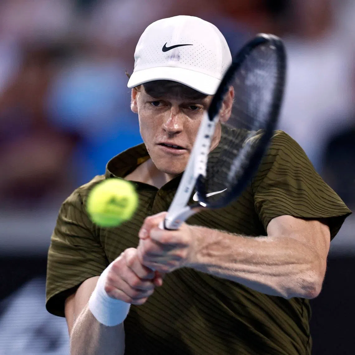 Tennis - Australian Open - Melbourne Park, Melbourne, Australia - January 26, 2026 Italy's Jannik Sinner in action during his fourth round match against Italy's Luciano Darderi REUTERS/Tingshu Wang