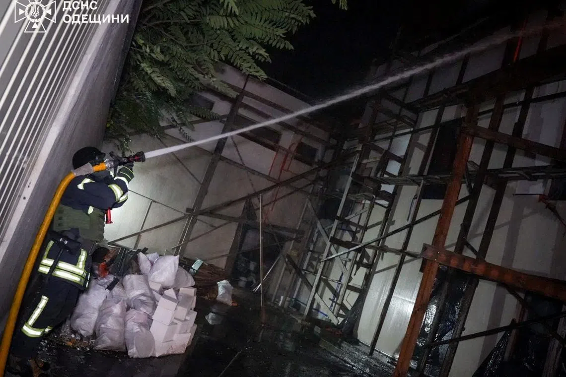 A firefighter works after a Russian missile struck a residential district, amid Russia's attack on Ukraine, in a location given as Odesa, Ukraine, in this handout picture released on October 19, 2024. State Emergency Service of Ukraine/Handout via REUTERS