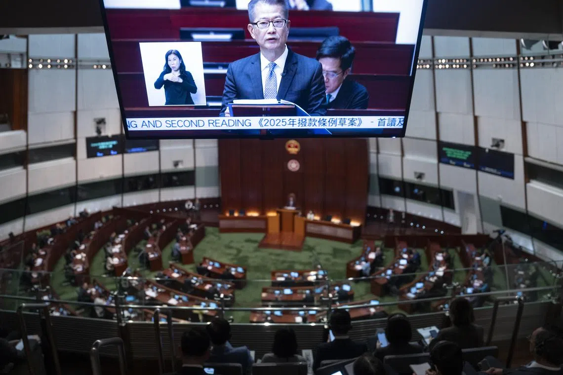 Hong Kong's Financial Secretary Paul Chan presents the annual budget for 2025-26 at the Legislative Council of Hong Kong, on Feb 26..