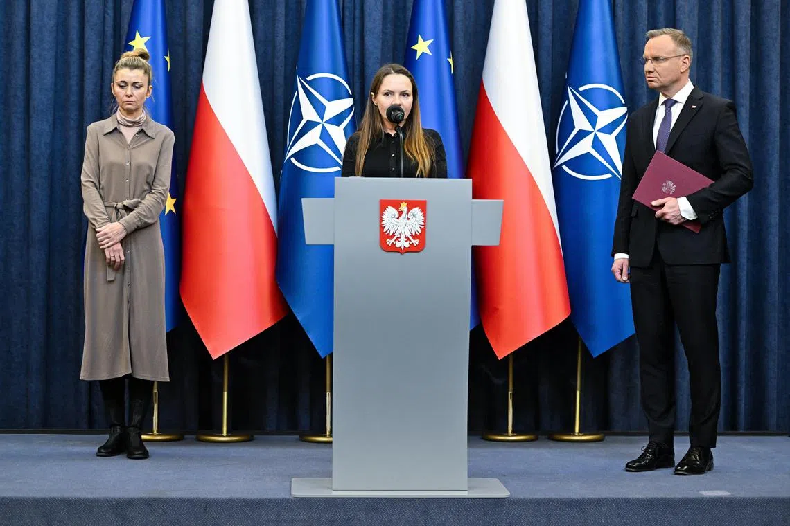 Polish President Andrzej Duda (right) met the lawmakers' wives, Ms Barbara Kaminska (centre) and Ms Roma Wasik, at the Presidential Palace in Warsaw.