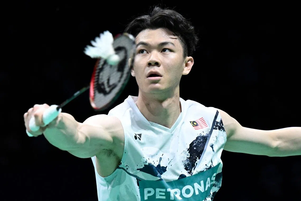 Malaysia's Lee Zii Jia hitting a return to Japan’s Kenta Nishimoto in the Thomas Cup quarter-finals in Chengdu, China, on May 2.