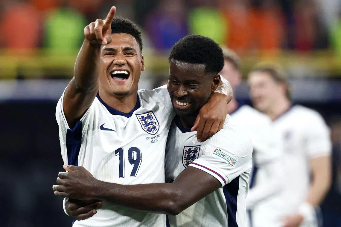 England forward Ollie Watkins (left) and defender Marc Guehi celebrate beating the Netherlands in the semi-final of Euro 2024.