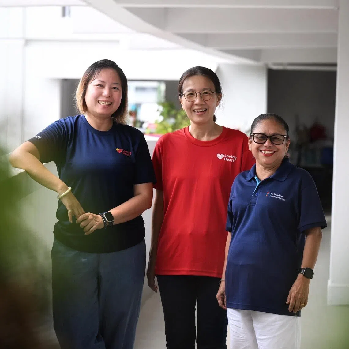 (From left) Loving Heart community health head Elaine Ho, Loving Heart volunteer Germaine Soh and Ranjit Kaur, a care connector under the new scheme.