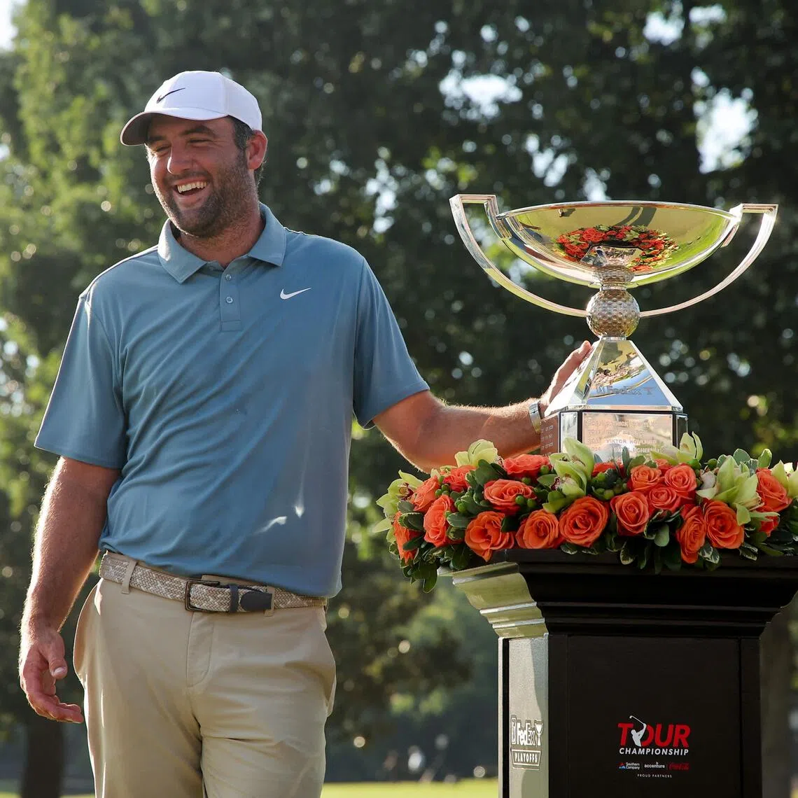 Scottie Scheffler all smiles with his trophy after the American came from behind to clinch the Tour Championship at East Lake Golf Club in Atlanta on Aug 30.