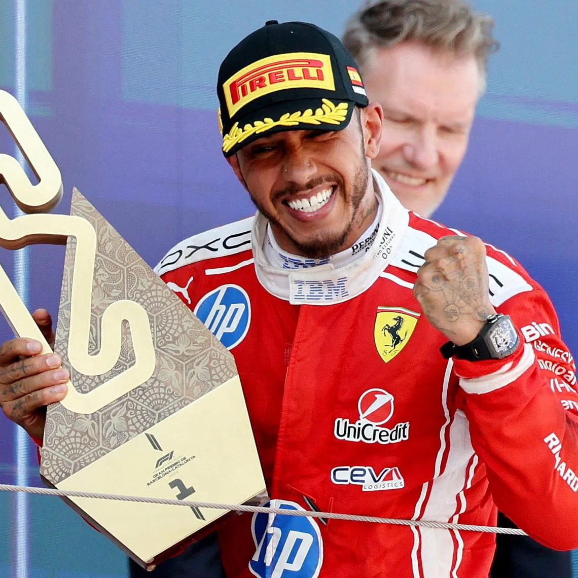 Formula One F1 - Barcelona-Catalunya Grand Prix - Circuit de Barcelona-Catalunya, Barcelona, Spain - June 14, 2026 Ferrari's Lewis Hamilton celebrates with the trophy after winning the Barcelona-Catalunya Grand Prix REUTERS/Nacho Doce