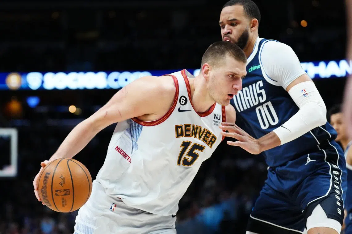 Dallas Mavericks center JaVale McGee defending Denver Nuggets center Nikola Jokic as the latter won 118-109 on Wednesday.