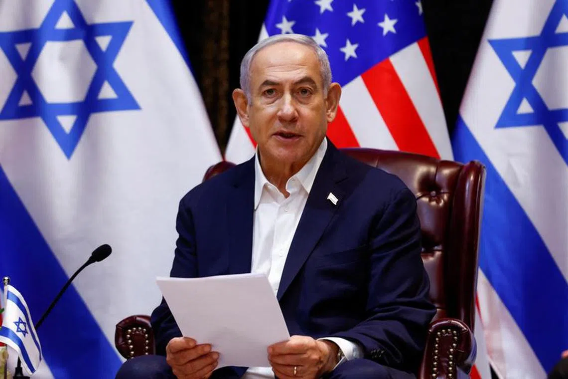 FILE PHOTO: Israeli Prime Minister Benjamin Netanyahu attends a meeting with U.S. President Joe Biden (not pictured) and the Israeli war cabinet, during Biden's visit to Israel, amid the ongoing conflict between Israel and Hamas, in Tel Aviv, Israel, October 18, 2023. REUTERS/Evelyn Hockstein/File Photo