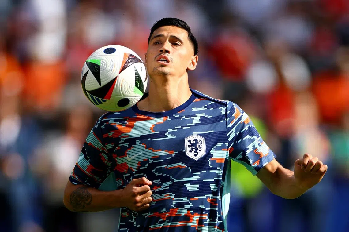 Soccer Football - Euro 2024 - Group D - Netherlands v Austria - Berlin Olympiastadion, Berlin, Germany - June 25, 2024 Netherlands' Tijjani Reijnders during the warm up before the match REUTERS/Lisi Niesner