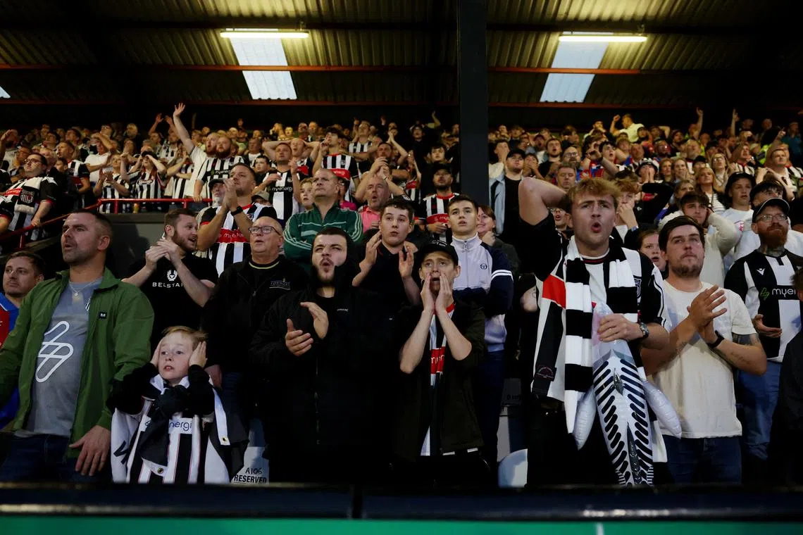 FILE PHOTO: Soccer Football - Carabao Cup - Second Round - Grimsby Town v Manchester United - Blundell Park, Grimsby, Britain - August 27, 2025 Grimsby Town fans Action Images via Reuters/Lee Smith/ File Photo