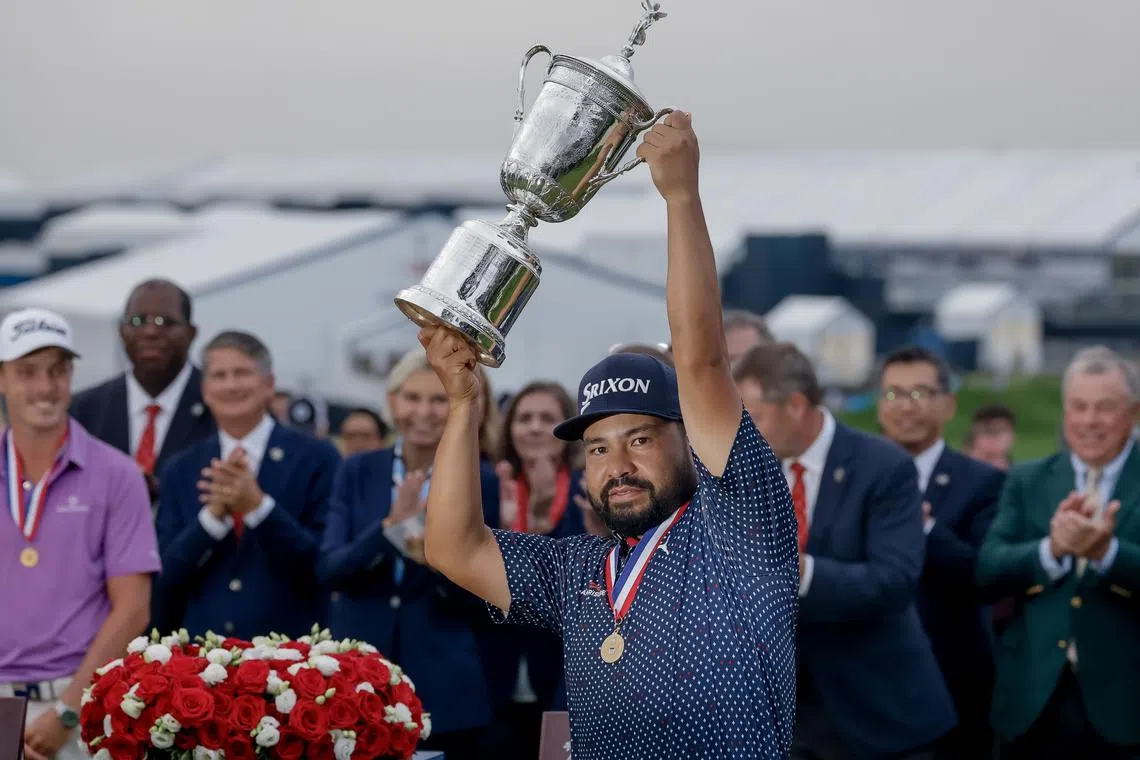 J.J. Spaun holds the USGA trophy after winning 2025 US Open golf tournament on June 15.