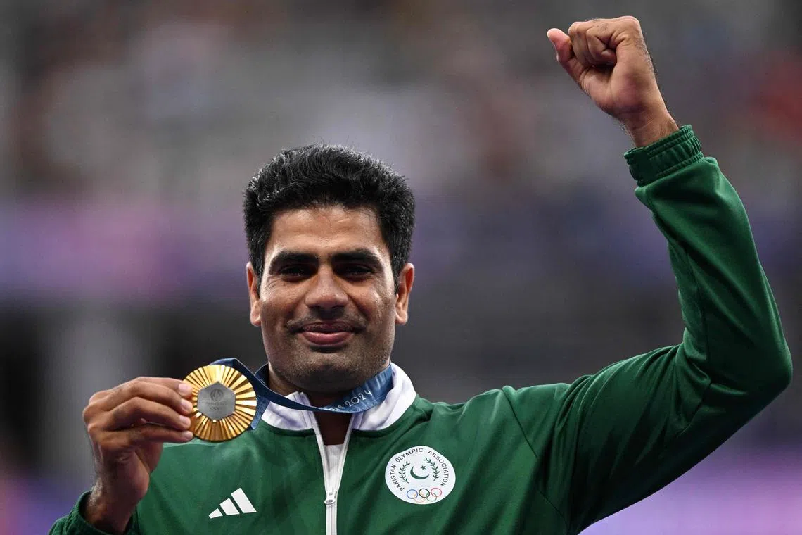 Gold medallist Arshad Nadeem of Pakistan celebrates on the podium during the victory ceremony for the men's javelin on Aug 9.