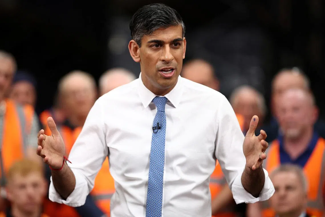 FILE PHOTO: British Prime Minister and Conservative Party leader Rishi Sunak holds a Q&A with staff of a West William distribution centre, as part of a campaign event ahead of a general election on July 4, in Ilkeston, Britain, May 23, 2024. HENRY NICHOLLS/Pool via REUTERS/File Photo