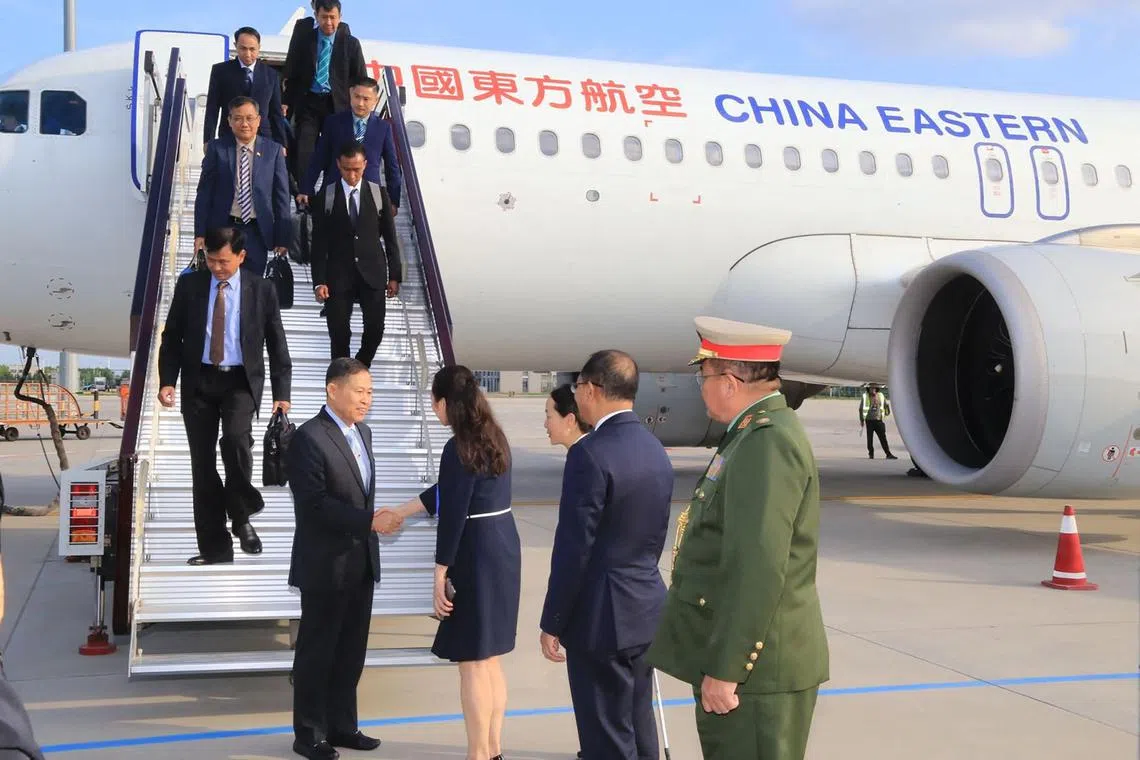 Vice-senior General Soe Win (centre) arrives in Qingdao, in China's Shandong province.