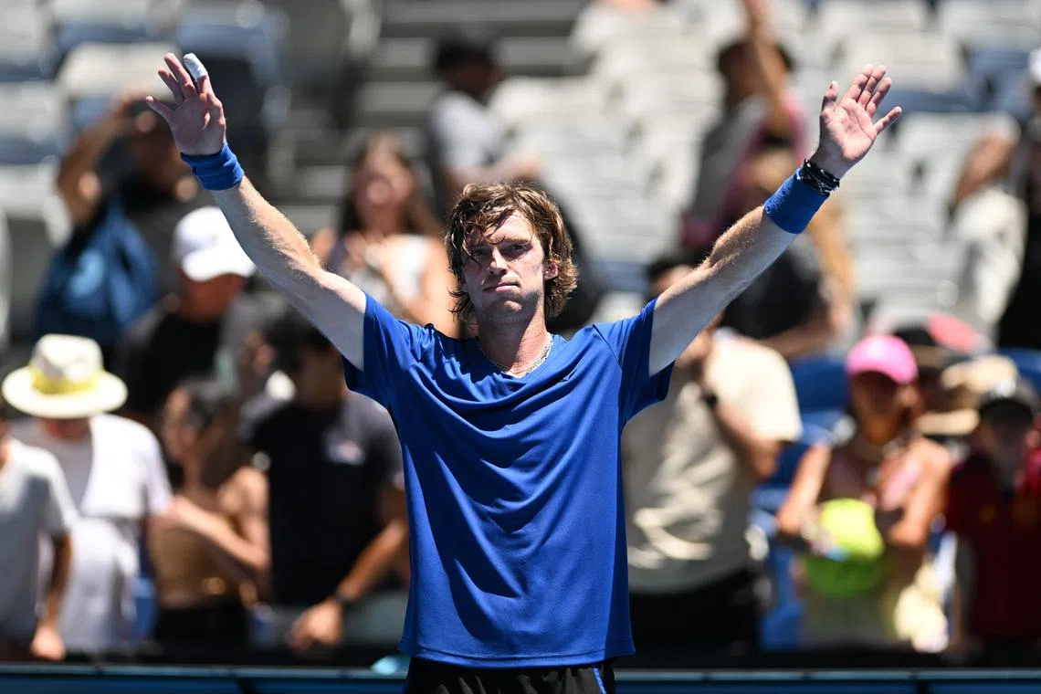 Andrey Rublev celebrates after defeating Dominic Thiem of Austria during their fist round match at the 2023 Australian Open on Jan 17.