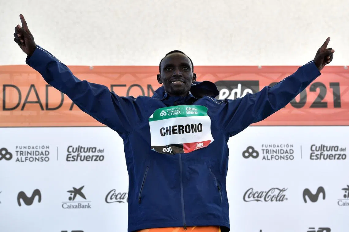 FILE PHOTO: Athletics - Valencia Marathon - Valencia, Spain - December 5, 2021 Kenya's Lawrence Cherono celebrates winning the men's race on the podium REUTERS/Pablo Morano/File Photo