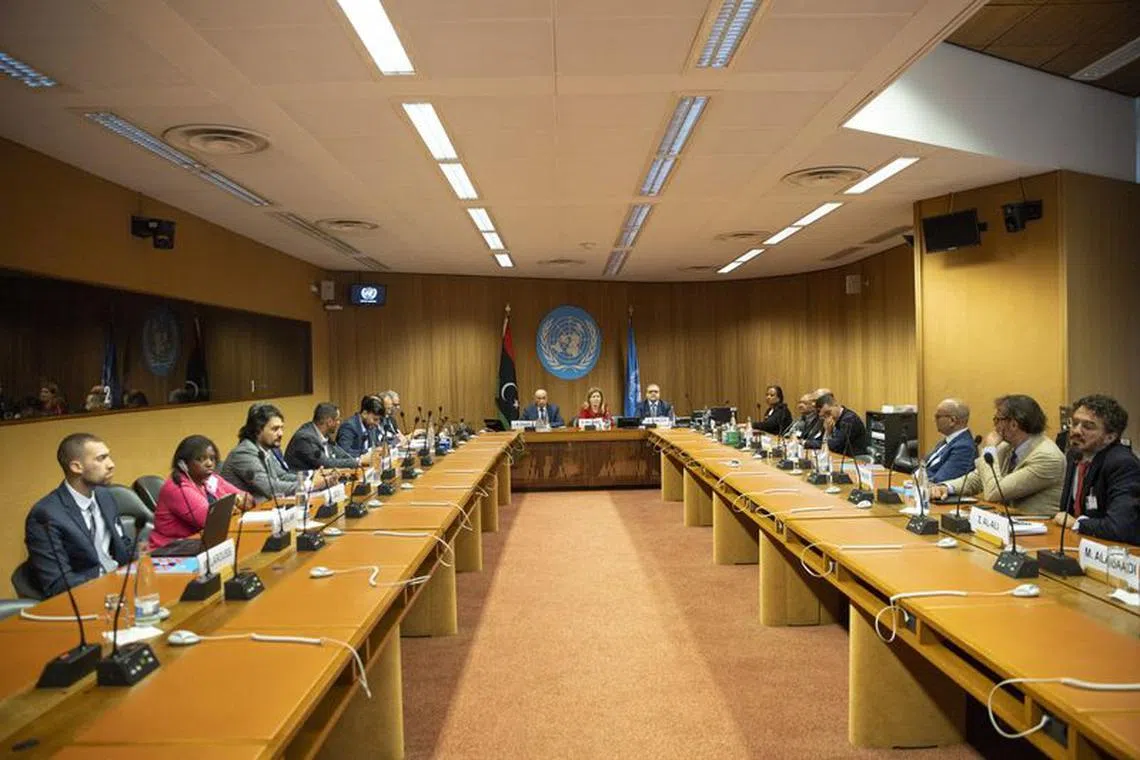 Speaker of the House of Representatives (HoR), Aguila Saleh, United Nations Special Adviser on Libya, Stephanie Williams and President of the High State Council of State (HSC), Khaled Al-Mishri, attend a High-level Meeting on Libya Constitutional Track at the United Nations in Geneva, Switzerland, June 28, 2022. REUTERS/Denis Balibouse/Pool/File Photo