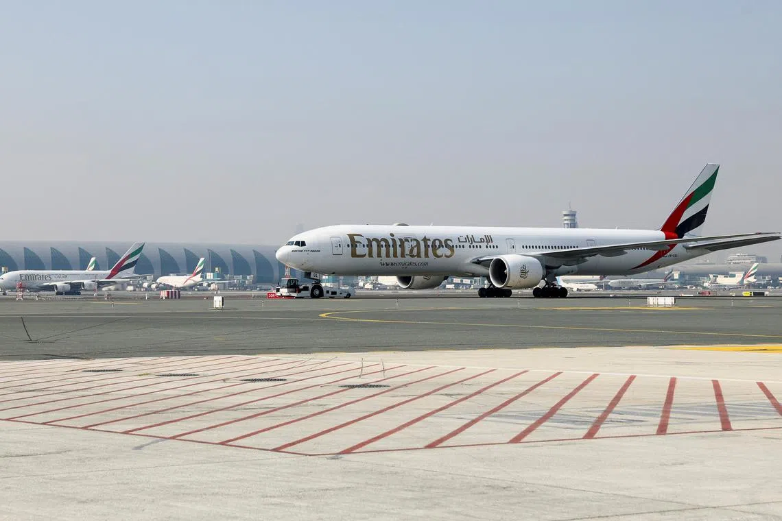 FILE PHOTO: Emirates airline planes are pictured at Dubai airport, in Dubai, United Arab Emirates, January 30, 2023. REUTERS/Rula Rouhana/File Photo