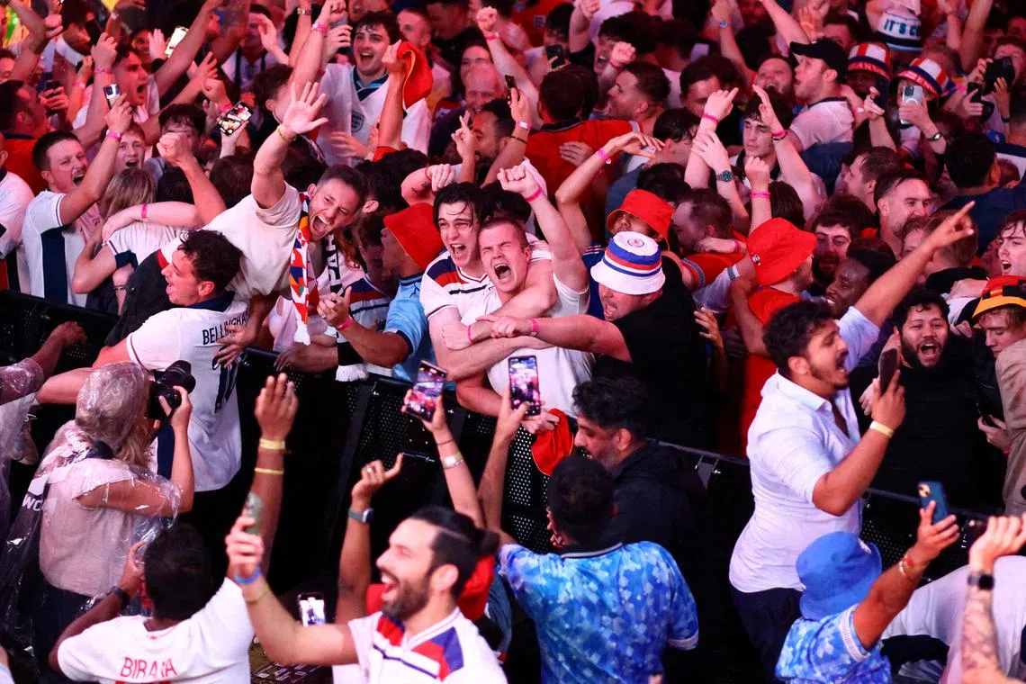 FILE PHOTO: Soccer Football - Euro 2024 - Fans gather for Netherlands v England - BOXPARK Wembley, London, Britain - July 10, 2024  England fans celebrate after the match REUTERS/David Klein/File Photo