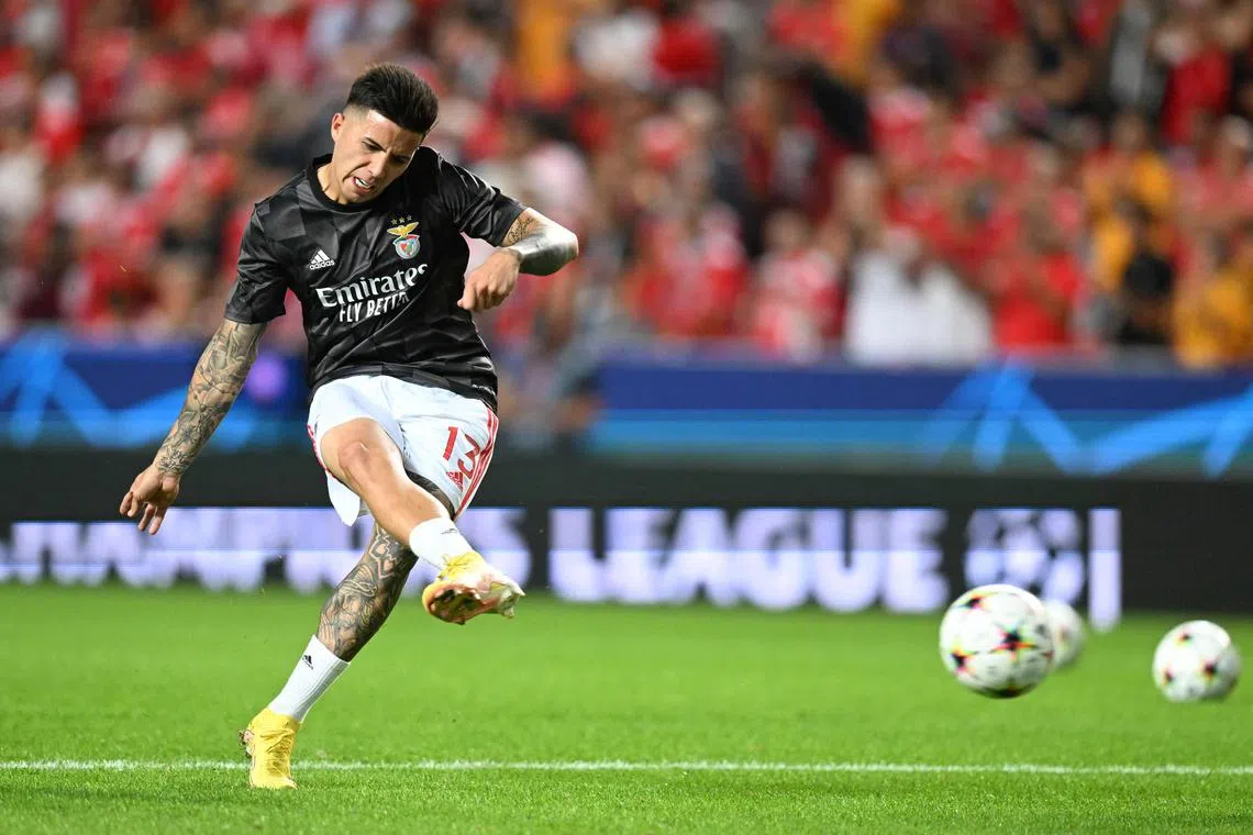 Benfica's Argentine midfielder Enzo Fernandez warming up before the Champions League football match against Paris Saint-Germain at the Luz stadium in Lisbon.