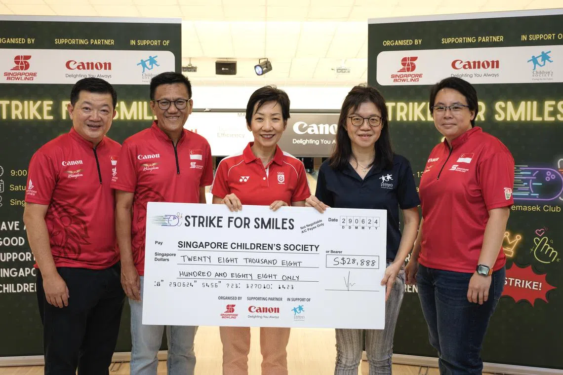 Singapore National Olympic Council president and Minister for Sustainability and the Environment Grace Fu presented a cheque for $28,888 to Singapore Children's Society.