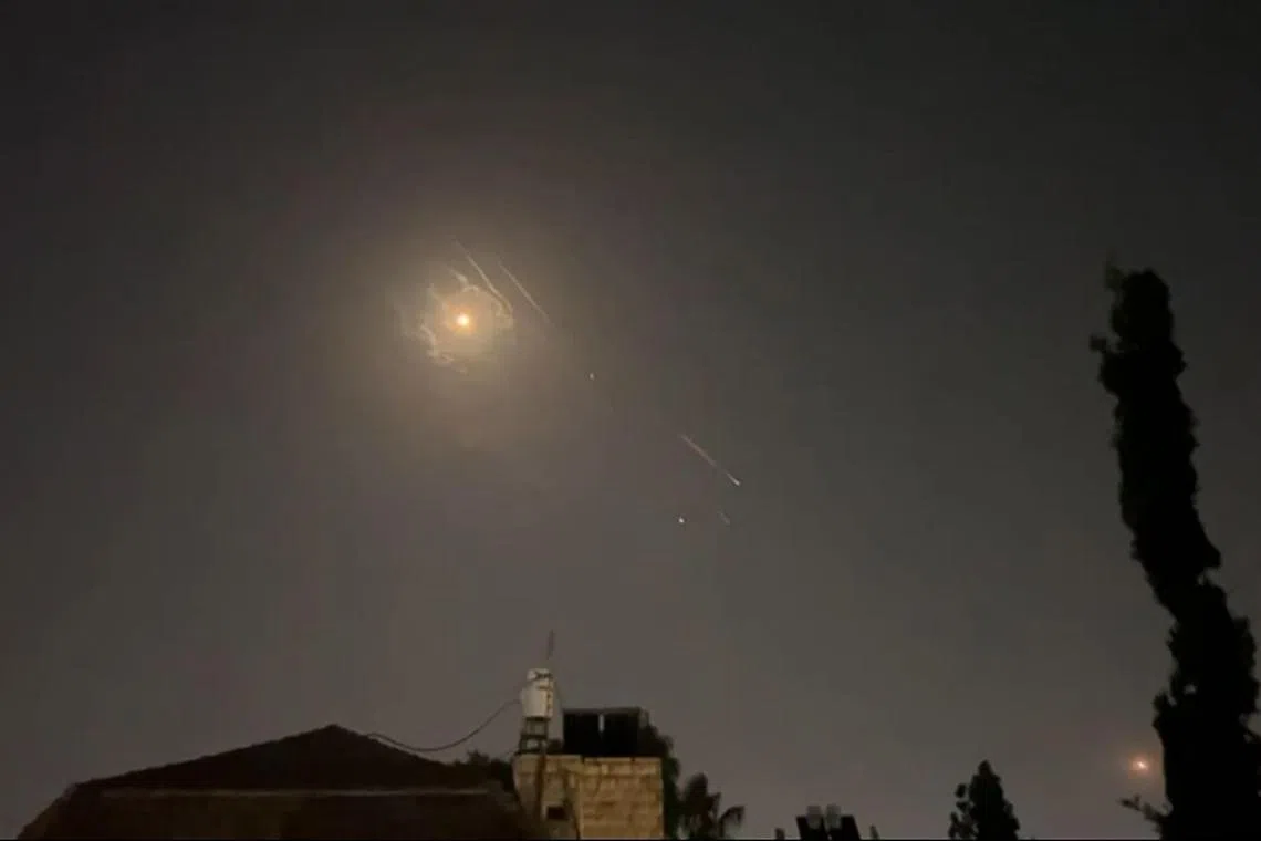 A video grab shows explosions lighting up the Jerusalem sky during Iran's attack on Israel. 