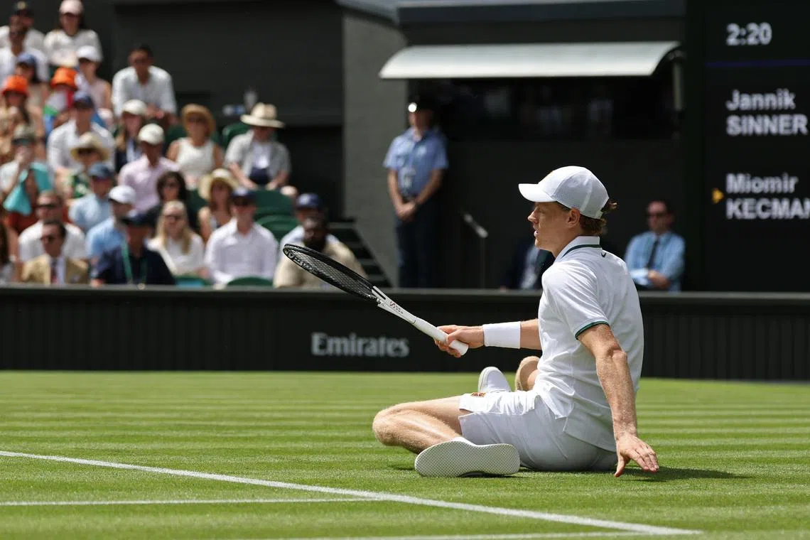 Jun 29, 2026; London, United Kingdom; Jannik Sinner (ITA) falls after playing a shot against Miomir Kecmanovic (SRB) (not pictured) on day one of The Championships Wimbledon 2026  at All England Lawn Tennis and Croquet Club. Mandatory Credit: Geoff Burke-Imagn Images