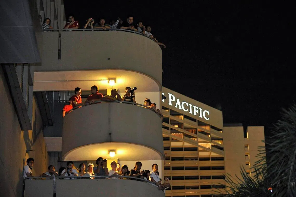 Spectators standing along a four-storey staircase at Marina Square, which afforded them a view of the portion of the F1 circuit opposite the Esplanade on race day in 2010.