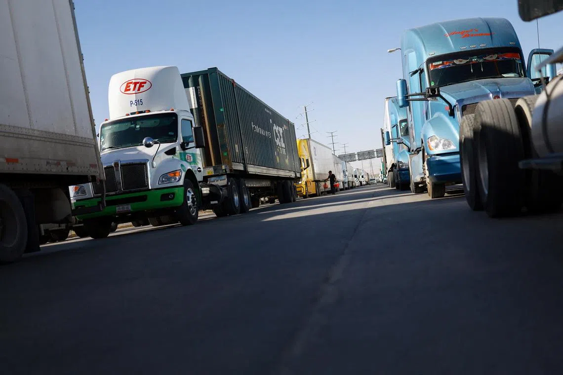 FILE PHOTO: Trucks wait in a queue at the Zaragoza-Ysleta border crossing bridge, in Ciudad Juarez, Mexico March 12, 2026. REUTERS/Jose Luis Gonzalez/File Photo