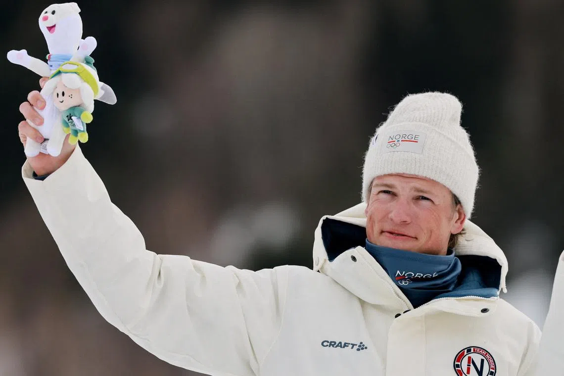 Milano Cortina 2026 Olympics - Cross-Country Skiing - Men's 50km Mass Start Classic - Tesero Cross-Country Skiing Stadium, Lago, Italy - February 21, 2026. Gold medallist Johannes Hoesflot Klaebo of Norway celebrates on the podium after the men's 50km mass start classic REUTERS/Stephanie Lecocq