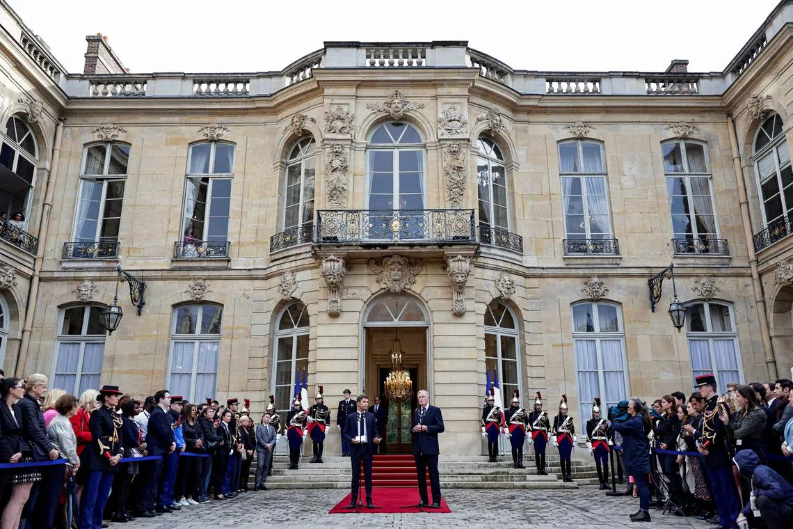 FILE PHOTO: France outgoing Prime minister Gabriel Attal delivers a speech next to newly appointed Prime minister Michel Barnier during the handover ceremony at the Hotel Matignon in Paris, France, September 5, 2024. Stephane De Sakutin/Pool via REUTERS/File Photo