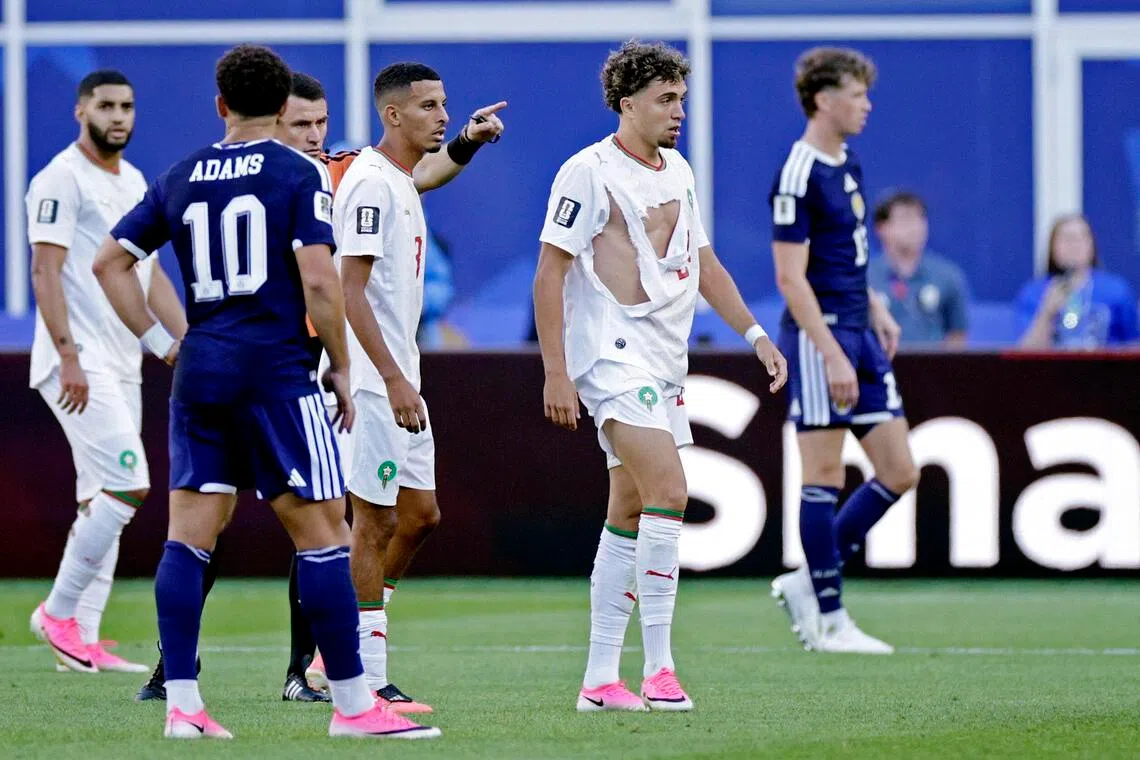 Morocco's Neil El Aynaoui in his torn jersey during a match against Scotland on June 19.
