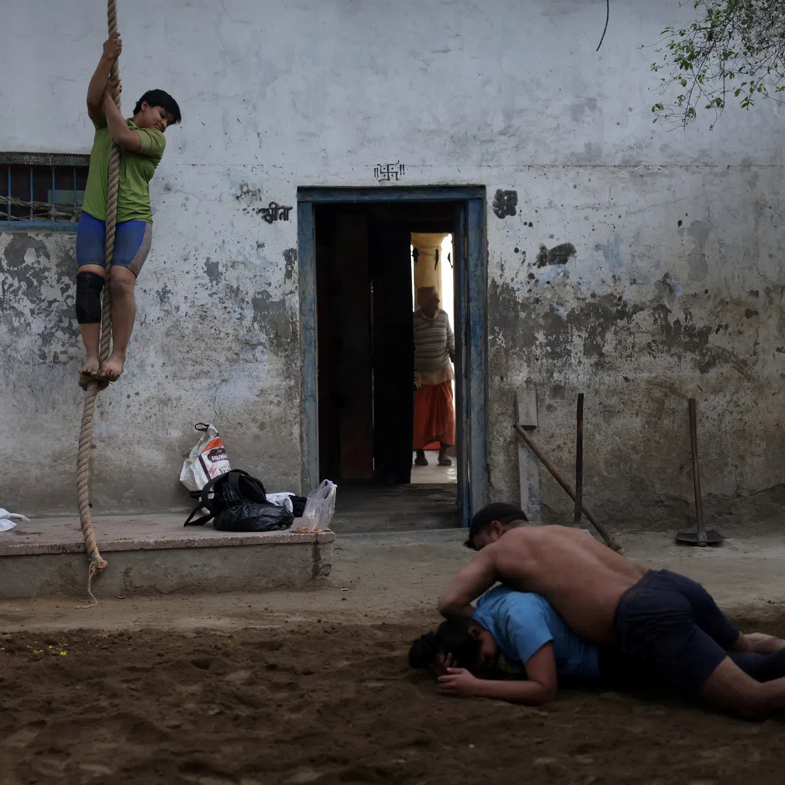 Wrestlers practice at an akhara on the banks of Yamuna river in New Delhi, India, December 10, 2025. REUTERS/Bhawika Chhabra/File Photo