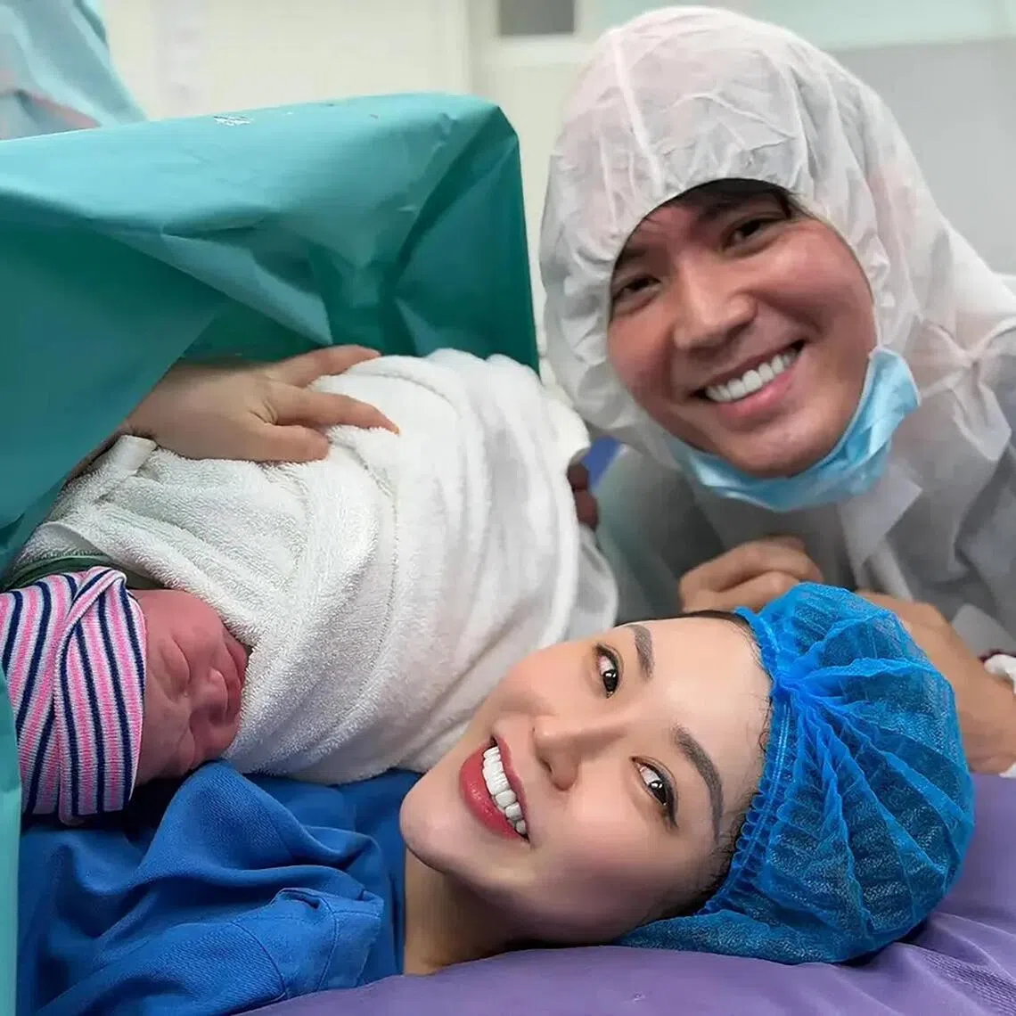 Singaporean actor Desmond Ng with his wife Kanny Theng and their newborn son Kai Kai.