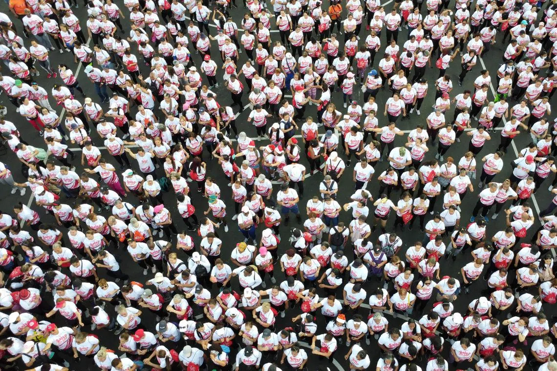 In this aerial view people participate in the second Aerobics Marathon with live Salsa music in Cali, Colombia, on December 14, 2022. 
