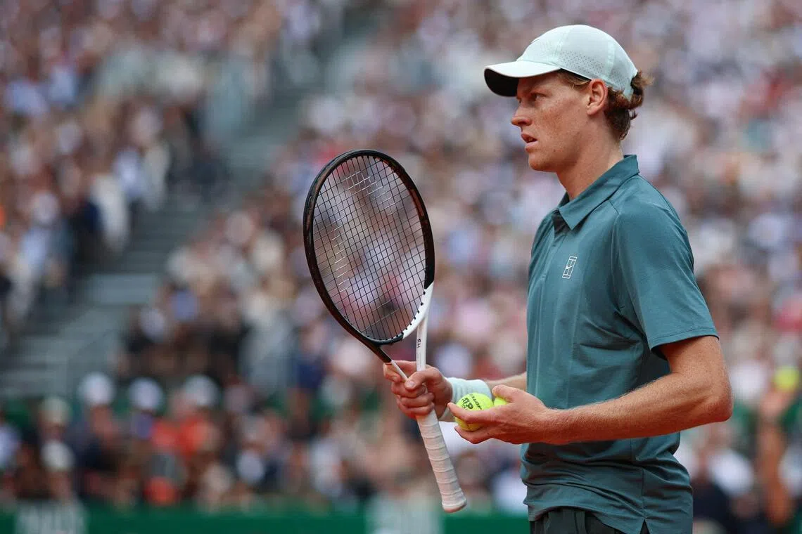 Italy's Jannik Sinner looks on as he plays against Spain's Carlos Alcaraz during the Monte Carlo ATP Masters Series Tournament final tennis match on Court Rainier III at the Monte-Carlo Country Club in Roquebrune-Cap-Martin, south-eastern France on April 12, 2026.