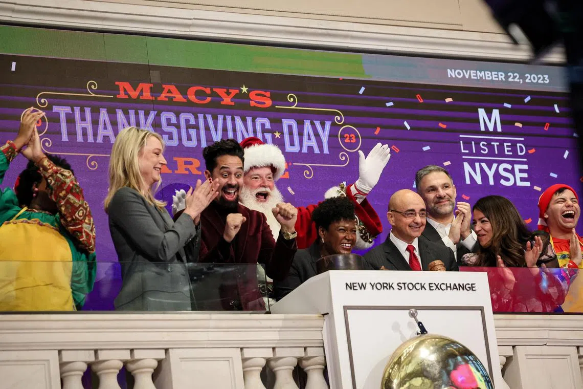 Macy's Santa Claus and other guests ring the opening bell to celebrate the 97th Macy’s Thanksgiving Day Parade, at the New York Stock Exchange. 