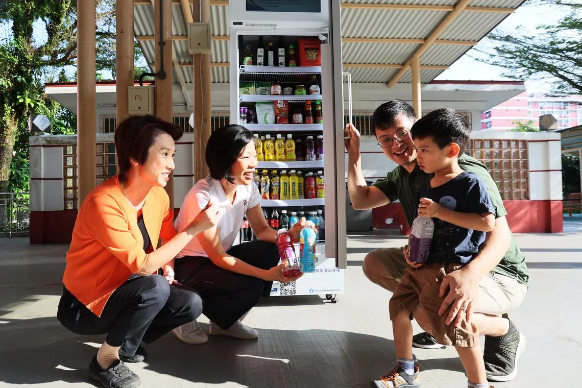 Ms Low Yen Ling, vice-chairwoman of PAP Women’s Wing (left) and Ms Sim Ann, chairwoman of PAP Women’s Wing at the launch of Smart Community Fridge within Holland-Bukit Timah GRC. 