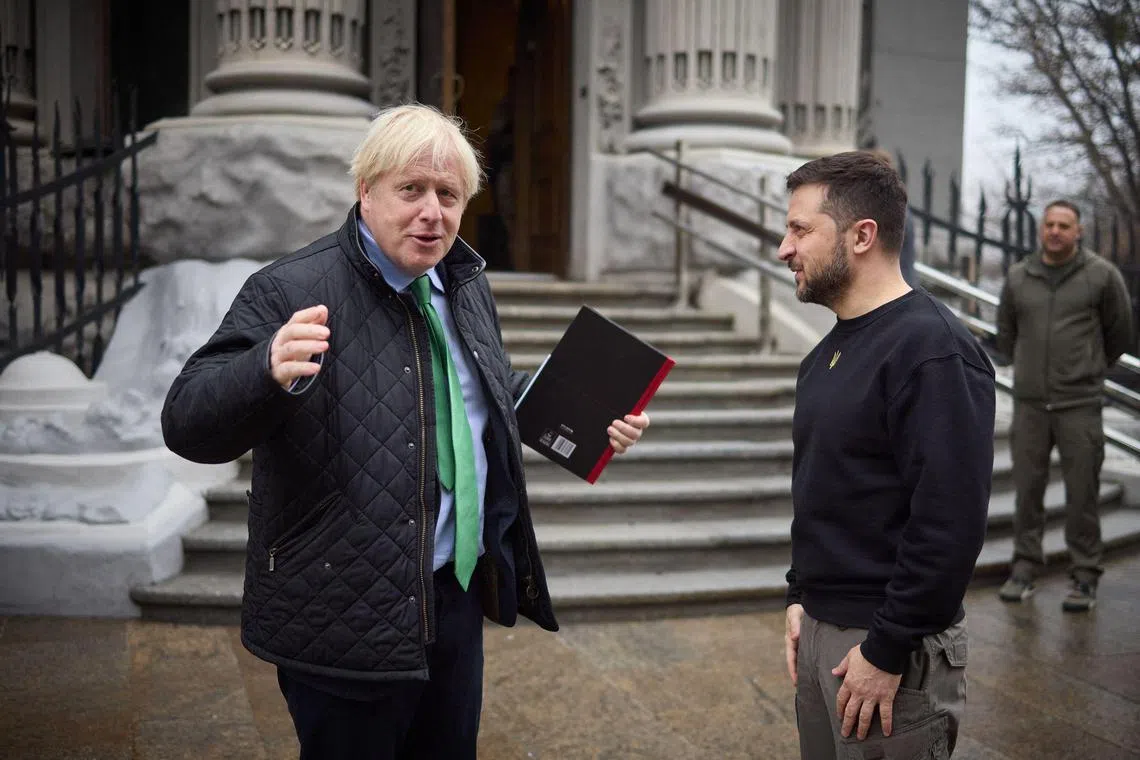Ukrainian President Volodymyr Zelensky (right) welcomes former British prime minister Boris Johnson to Kyiv.
