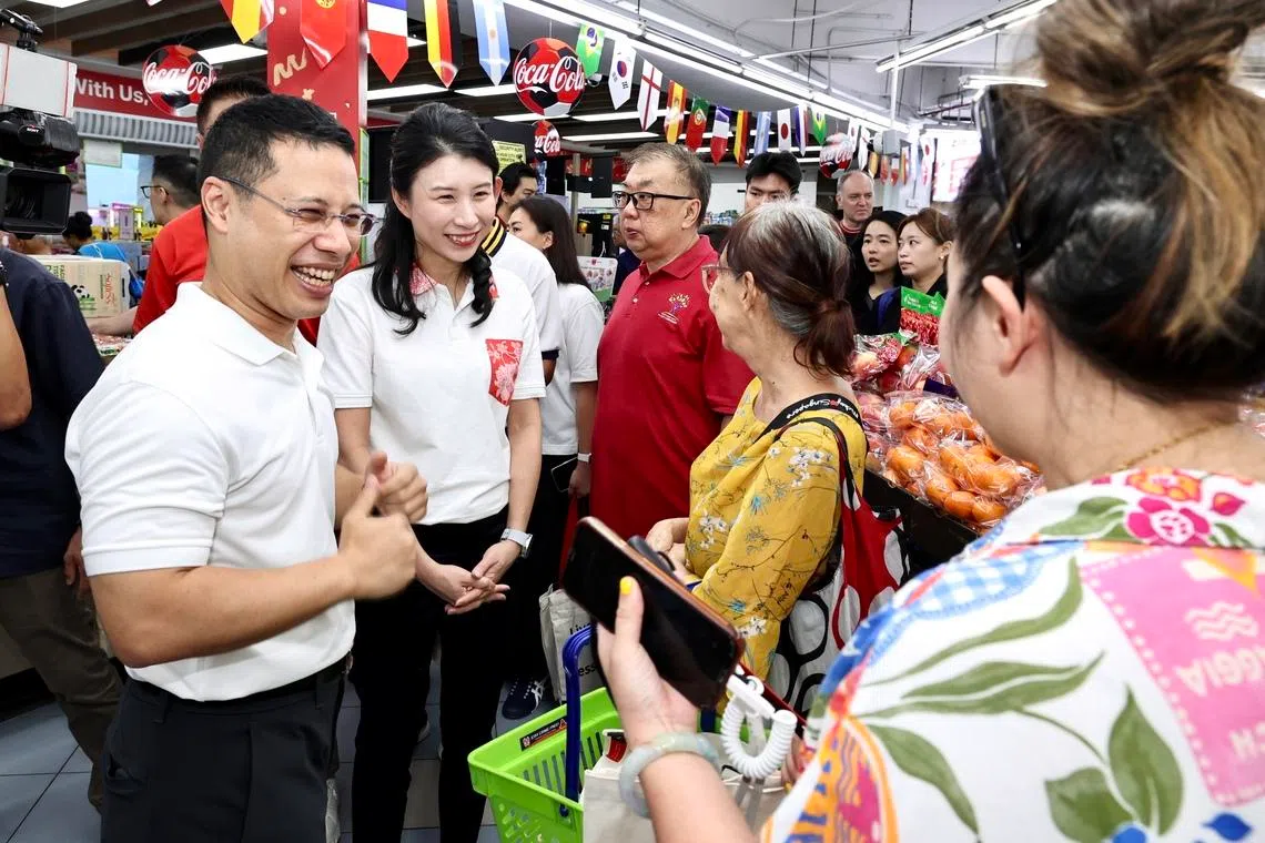 Education Minister and West Coast-Jurong West GRC MP Desmond Lee (left) at the official launch of the DBS Saturday Savings programme at Sheng Siong’s West Coast outlet on July 18.