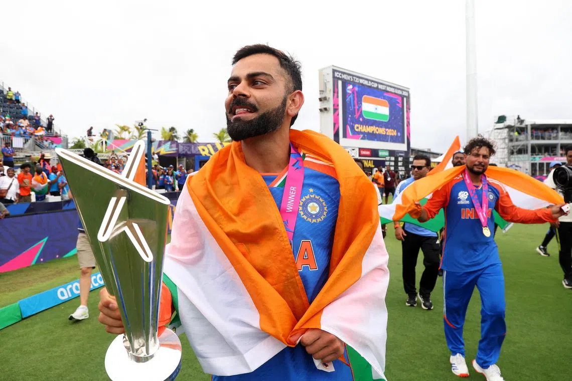 India's Virat Kohli celebrating with the trophy after winning the T20 World Cup, on June 29.