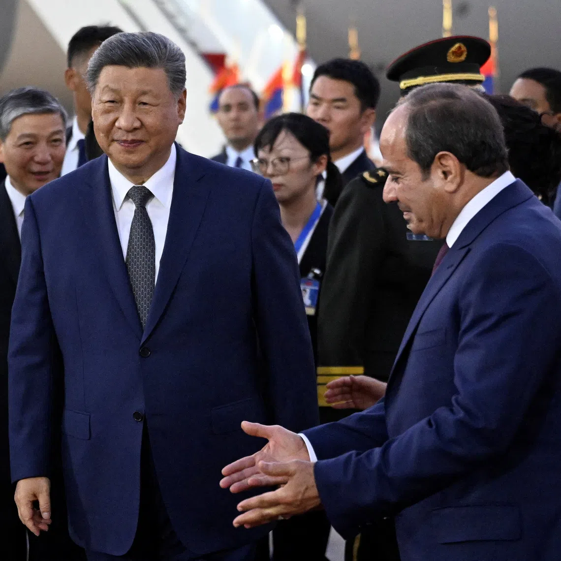 Egypt’s President Abdel Fattah al-Sisi welcomes his Chinese counterpart Xi Jinping in Cairo.