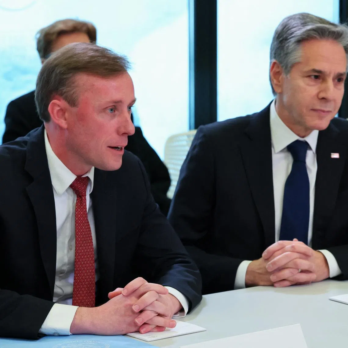 U.S. Secretary of State Antony Blinken looks on as U.S. National Security Advisor Jake Sullivan speaks, while they meet with Ukraine's President Volodymyr Zelenskiy (not pictured) during the 54th annual meeting of the World Economic Forum in Davos, Switzerland, January 16, 2024. REUTERS/Denis Balibouse