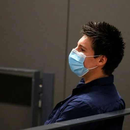 Rui Pinto, the Portuguese man believed to be the mastermind behind Football Leaks, waits before his trial at the court in Lisbon on Sept 4, 2020.