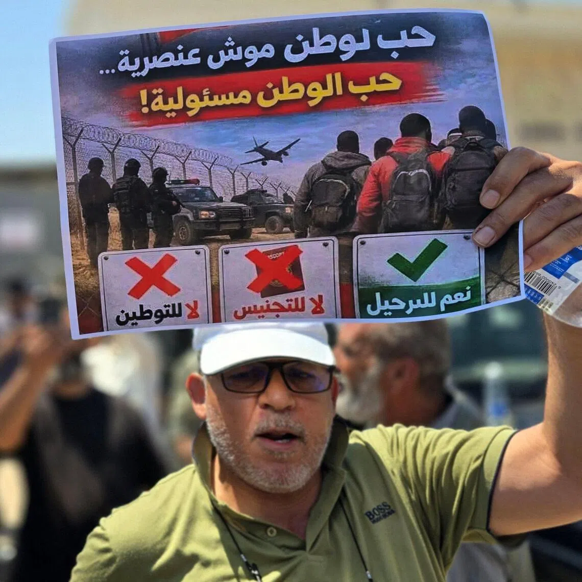 Libyans demanding the closure of the UN refugee agency headquarters in Tripoli on June 4 and declaring "No to foreign settlement in Libya".
