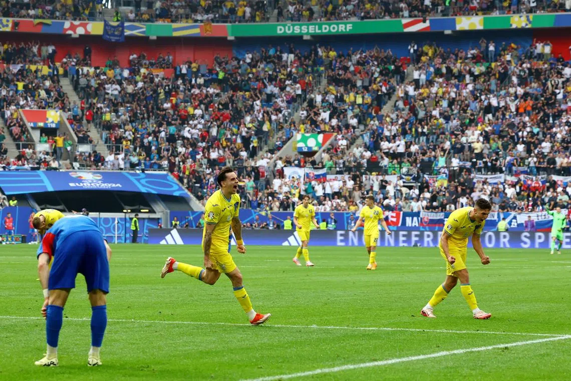 Ukraine's Mykola Shaparenko celebrates scoring their first goal against Slovakia in their Euro 2024 clash.