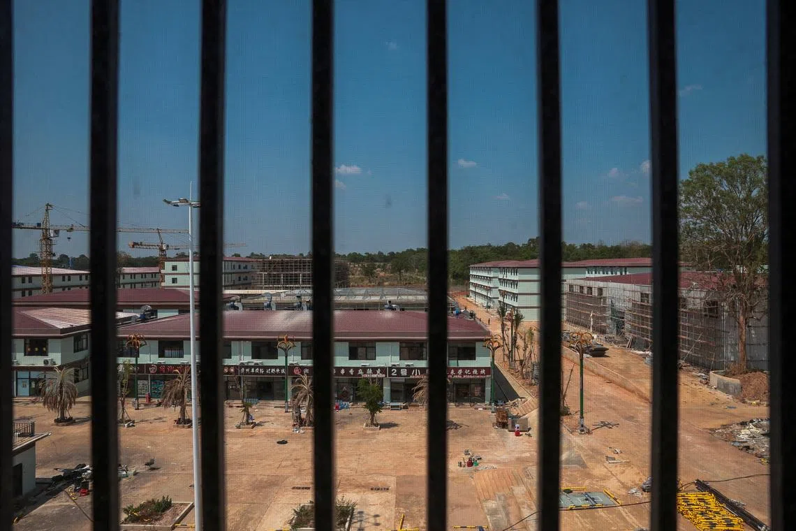 FILE PHOTO: A compound in O'Smach used for scam operations is seen through barred windows from inside the compound, at the Chong Chom-O'Smach border crossing, which was bombed and occupied by the Thai military in December following clashes between Thailand and Cambodia along a disputed border area, in Samraong, Oddar Meanchey province, Cambodia, April 7, 2026. REUTERS/Chalinee Thirasupa/File Photo